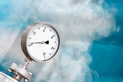 Pressure gauge of an industrial heating system. Oil refinery. The grain and texture added.SEE ALSO: